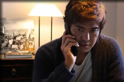 商社マン藤井(佐藤浩一)